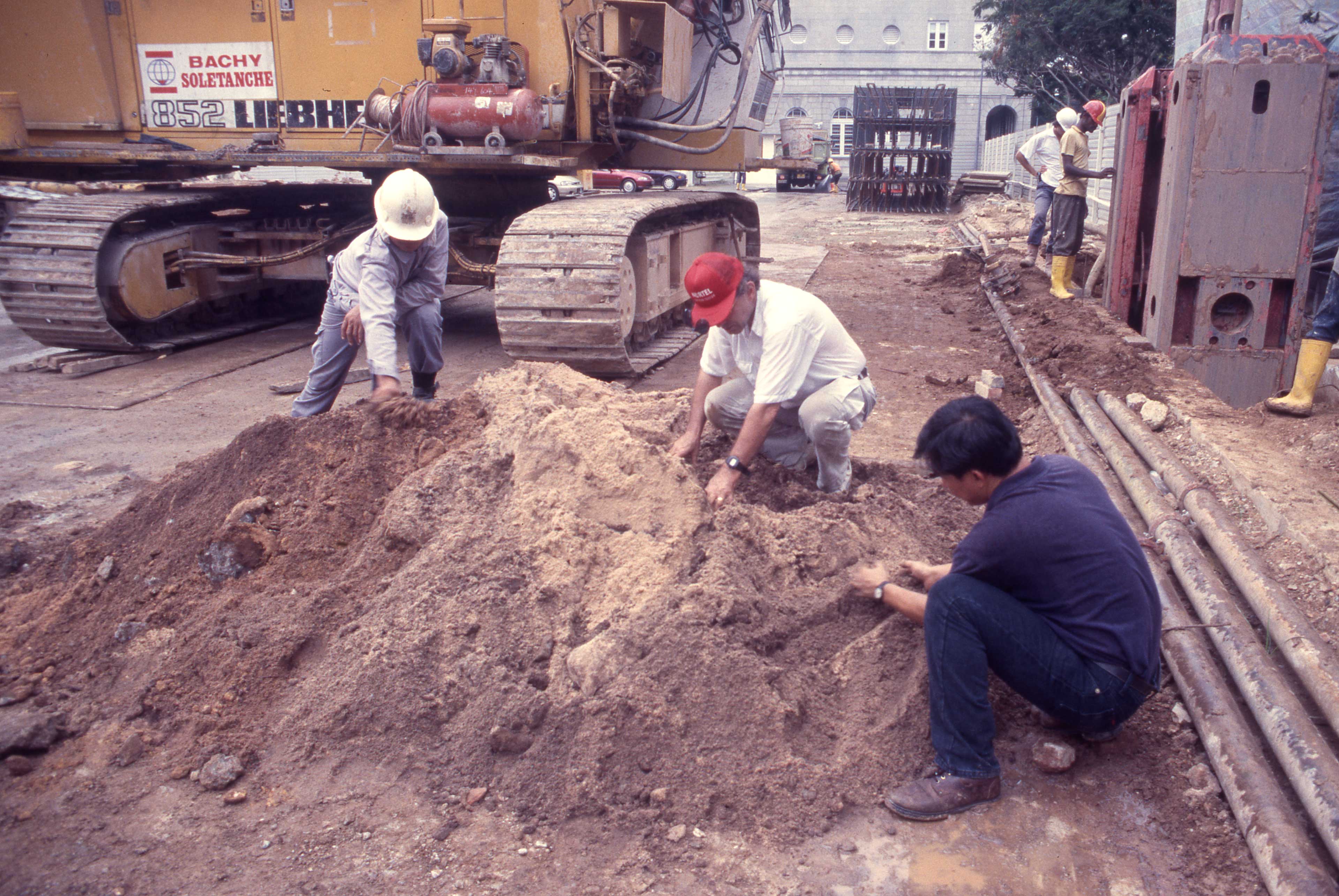 July 18 2000 Miksic and Ng sorting backdirt from backhoe excavation, July 2000.