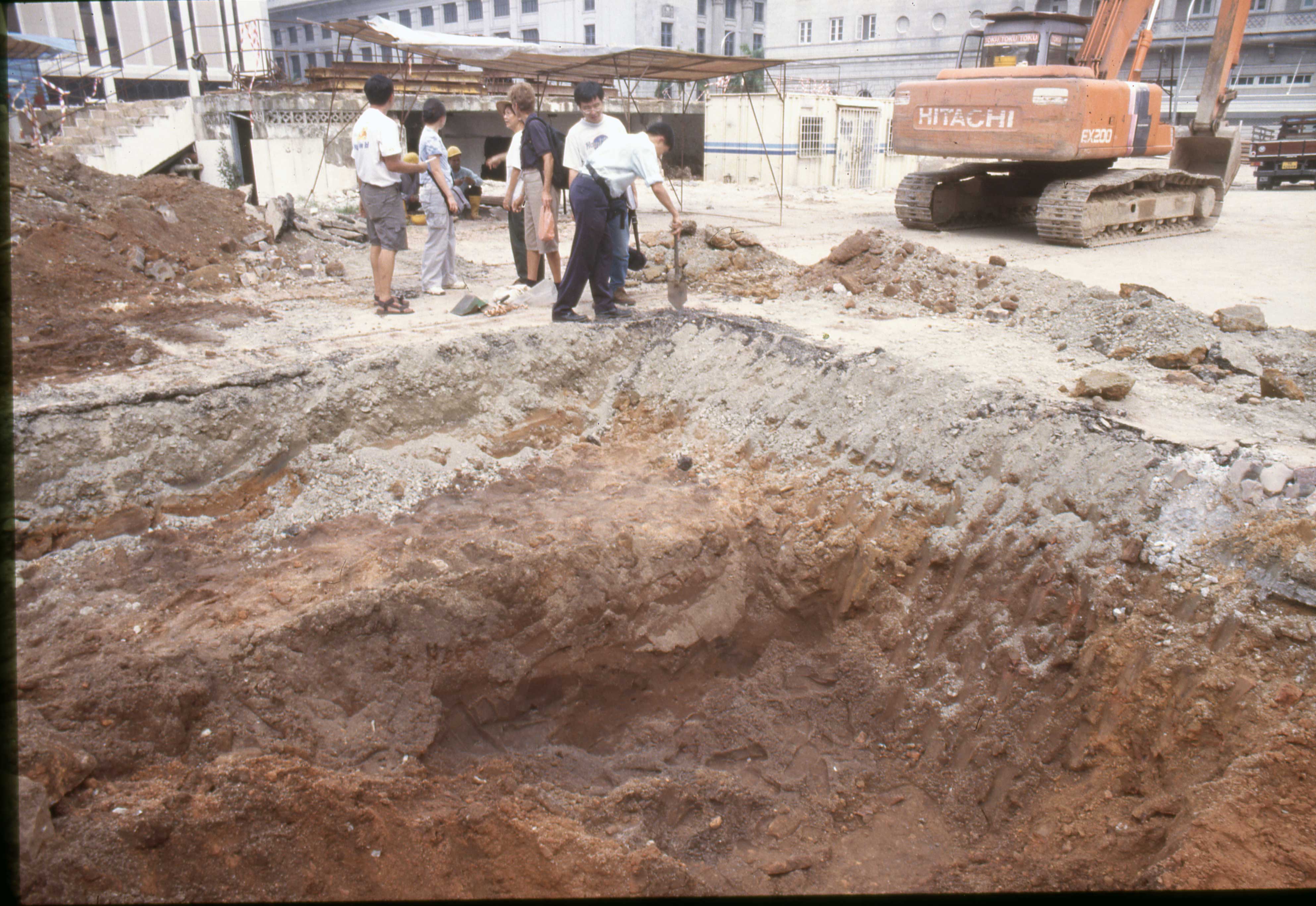 Volunteers investigating construction backdirt.