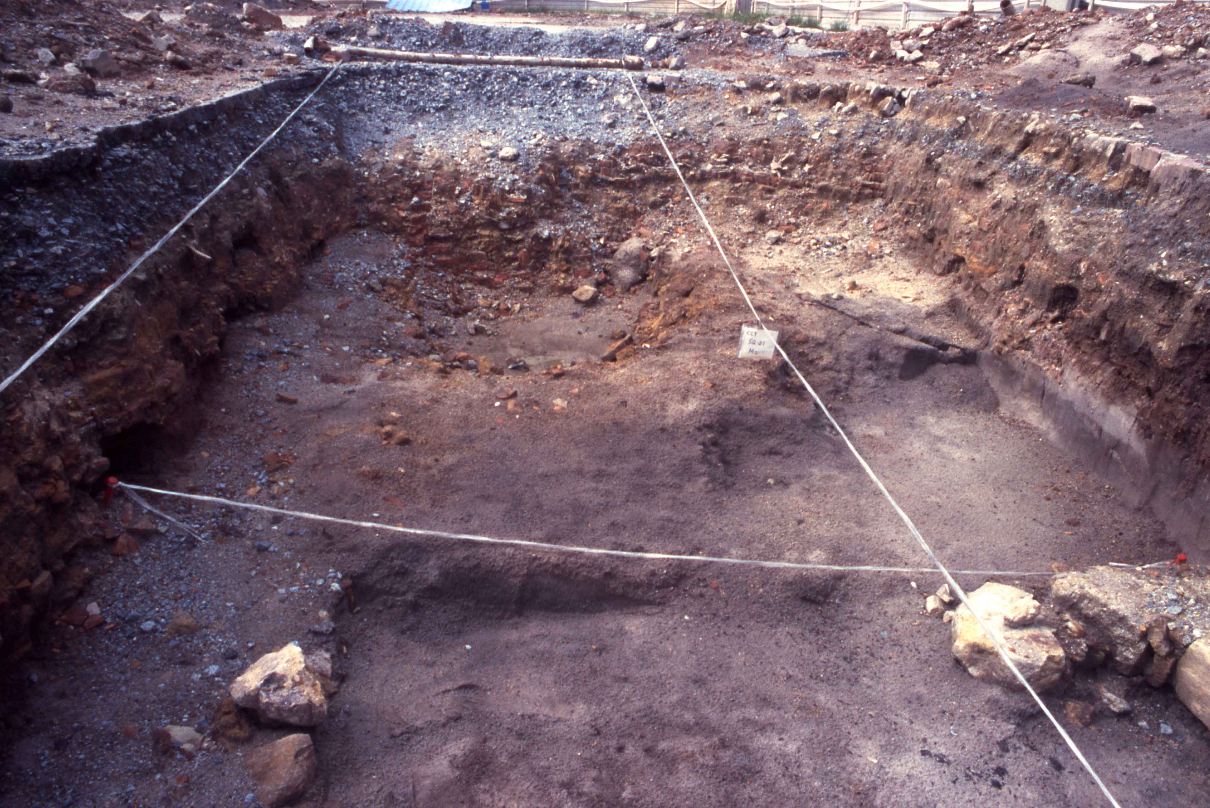 Black sand layer, clearly visible in the profile at right. Charcoal flecks visible at lower right, near 19th- century intrusion.