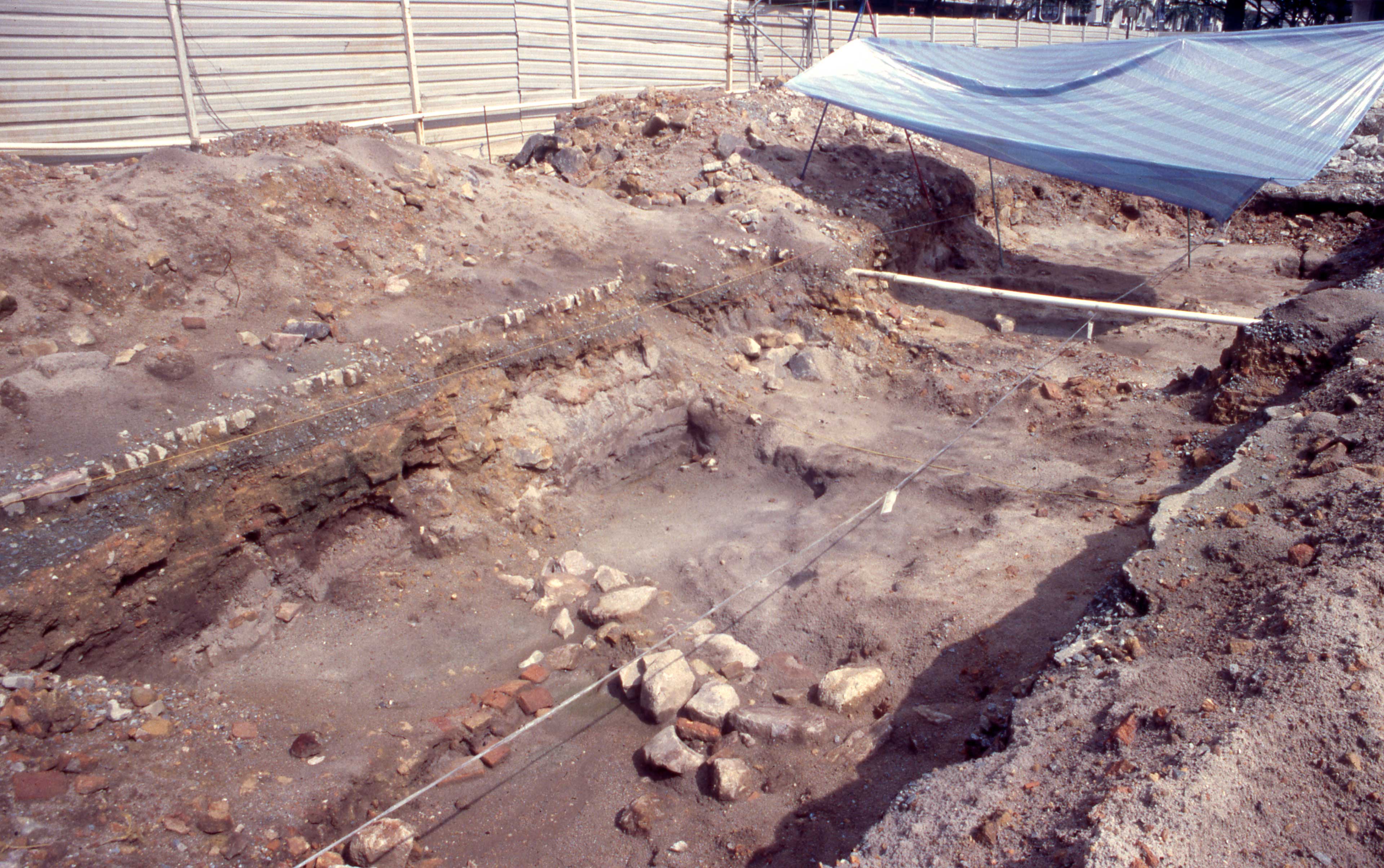 Square II, again after heavy rain, showing disturbance caused by excavation of the foundation of a 19th-century building into the 14th–16th century stratum.