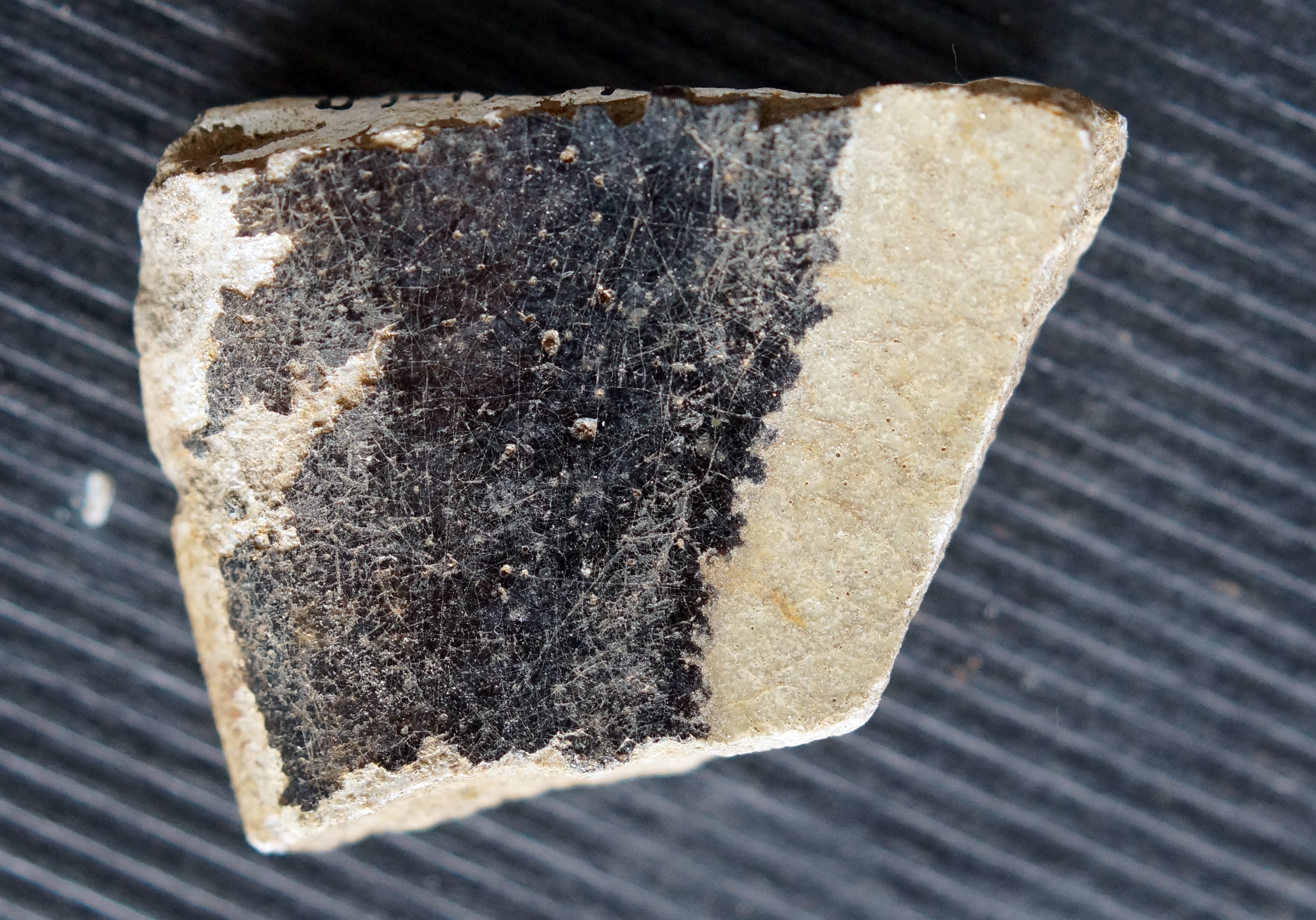 Photo 93: below right: black-glazed sherd
