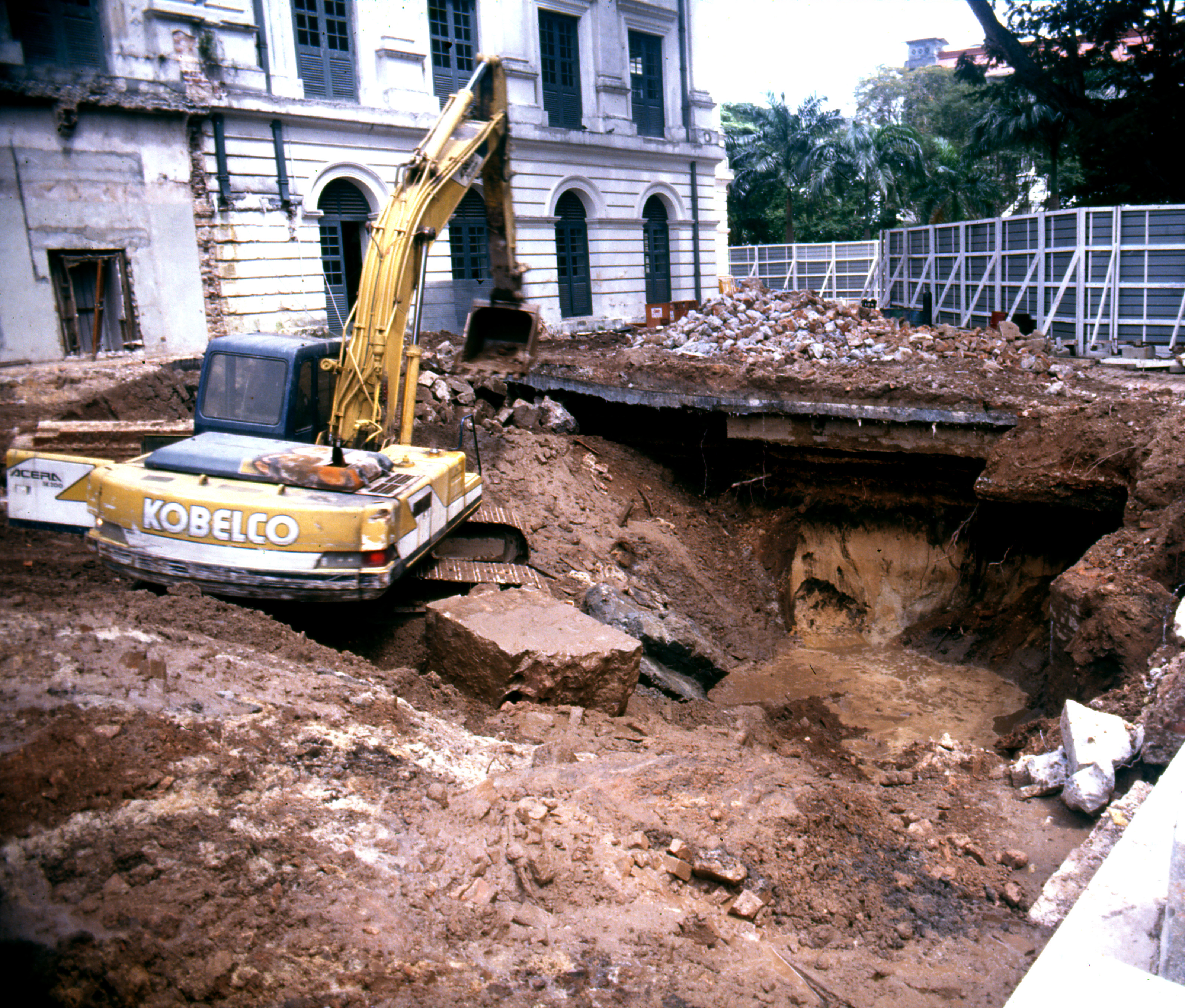 Figure 3. Demolition work in 1990 reveals the black layer containing artefacts.