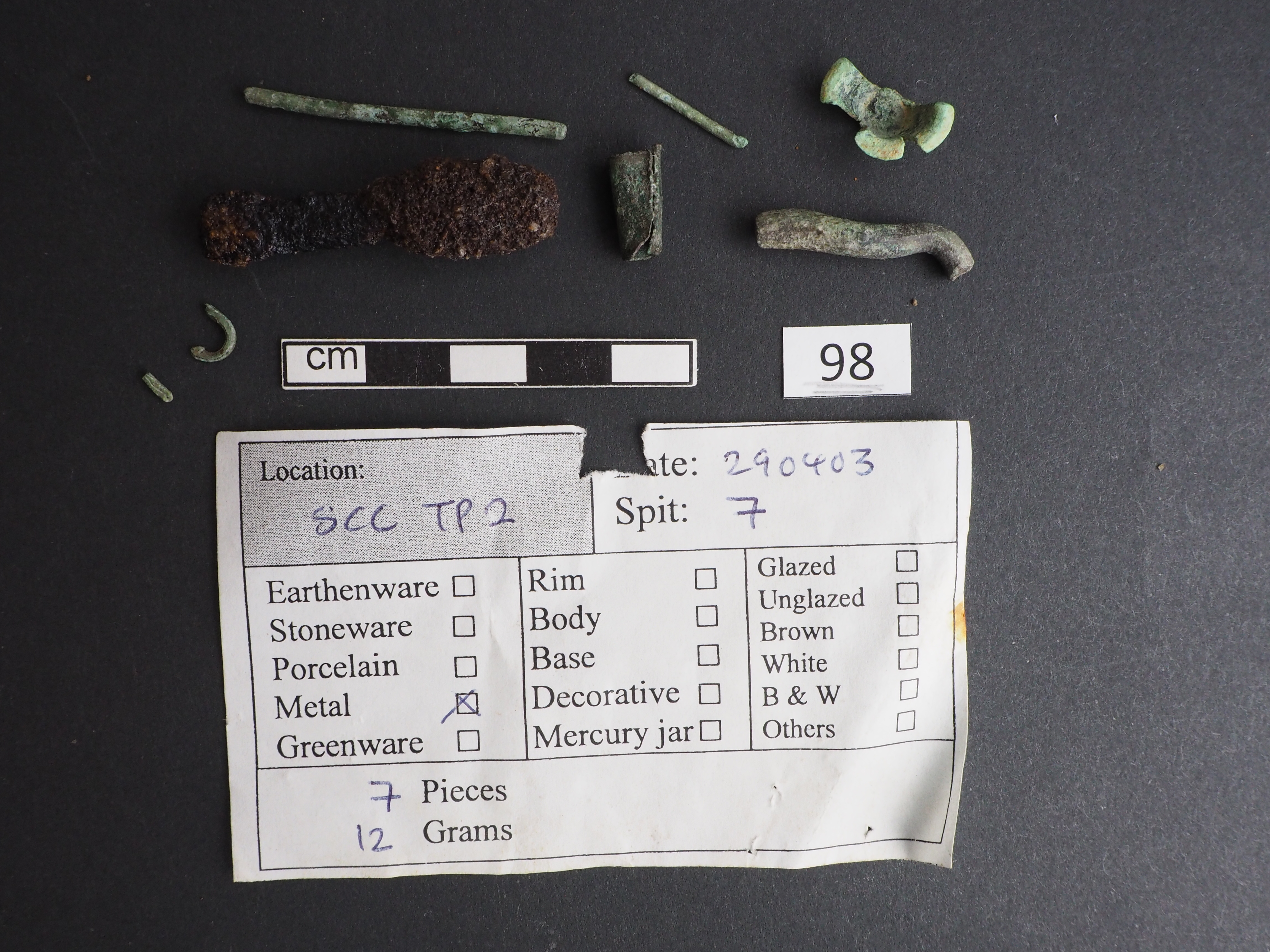 <strong>Plate 10</strong> Iron slags cleaned and coated with 20% B72. Copper items cleaned with ethanol and coated with microcrystalline wax.