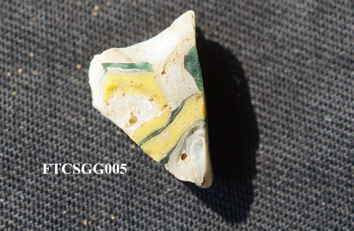 Figure 67. inlaid glass shard of a vase