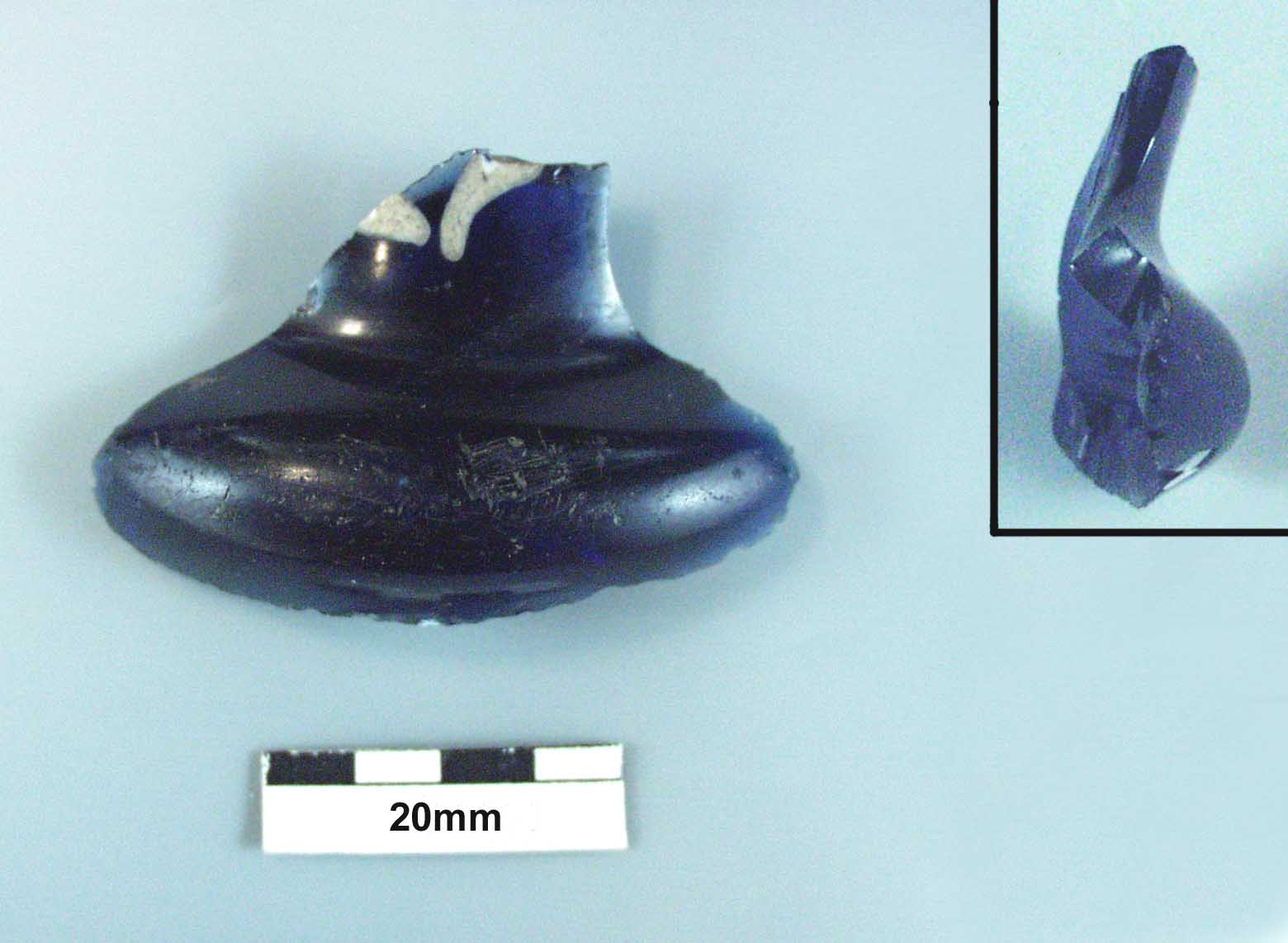 Figure 16: An indigo blue glass bottle with white inlaid glass motif